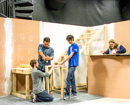 Film and video production majors build a set
