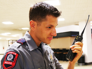 Jake McMahon/Pioneer Officer Patrick Martino shows one of the new radios received by the OCCC police department.