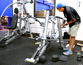 Clayton Mitchell/Pioneer Bryan Balenseifen of Treadmill Heroes puts together new equipment in the Wellness Center. “This is a shoulder press,” Balenseifen said. Treadmill Heroes is an exercise equipment repair and delivery company, hired by OCCC to help with the new equipment the college recently added. For more information about the new workout equipment or the Wellness Center, contact Recreation and Fitness at 405-682-7860. 