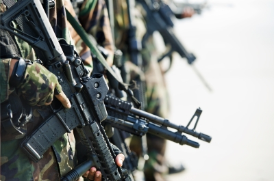 soldiers in a line holding guns