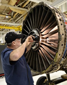 Bob Gianettino does blue dying on a TF33 engines fan blades to show theyve been worked on. (Air Force photo by Kelly White)