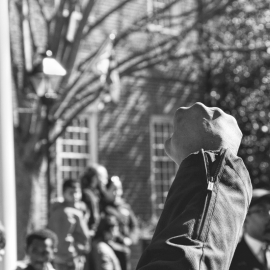 Protests in front of building. Photo by Canva