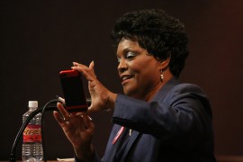 Connie Johnson takes photo of her audience at a recent conference. Photo by Cici Simon 