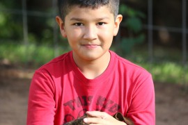 Benjamin Joseph Carter takes in the Oklahoma sun. Like his sister, Emily, BJ is a former foster child who was later adopted. Photo by Cici Simon