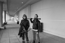 Two cosplayers dress as Daryl Dixon and Negan from The Walking Dead. Photo by Sean Stanley